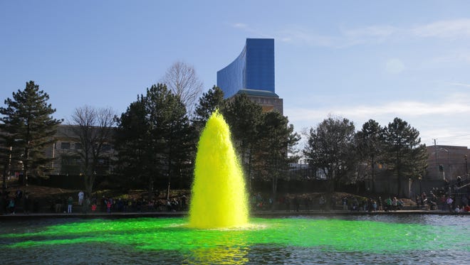 The canal changes color during the annual Greening of the Canal presented by the Hoosier Lottery in Indianapolis on Thursday, March 15, 2018. 