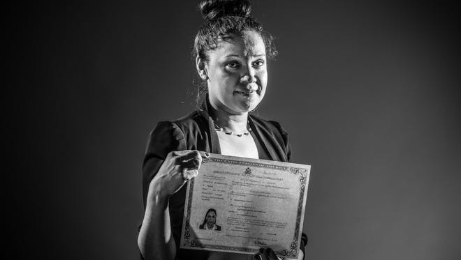 Jaqueline Soza Martinez, formerly a resident of Nicaragua, poses for a portrait after becoming a U.S. citizen following a naturalization ceremony at Central Library in Indianapolis, on Tuesday, June 19, 2018.