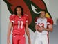 Larry Fitzgerald and teammate Kurt Warner display the Cardinals' new uniforms in April 2005 at the James Hotel in Scottsdale.