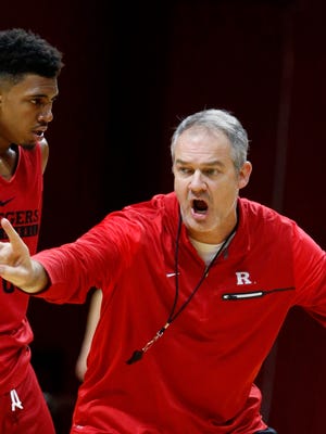 New head coach Steve Pikiell instructs Corey Sanders and the other Rutgers players.