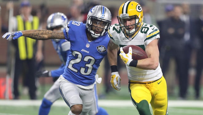 Lions cornerback Darius Slay tackles Packers receiver Jordy Nelson in the second half Jan. 1, 2017 at Ford Field.