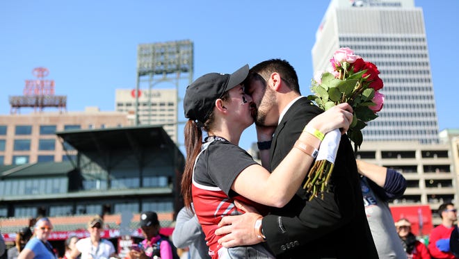 December 2, 2017 - Kassade Keyton kisses Aaron Wondra after he proposed to her following her completion of the half marathan during the 16th Annual St. Jude Memphis Marathon Weekend at AutoZone Park on Saturday. More than 25,000 people from 49 states and 19 countries participated in the occasion which is the largest single-day fundraising event for St. Jude Children's Research Hospital.