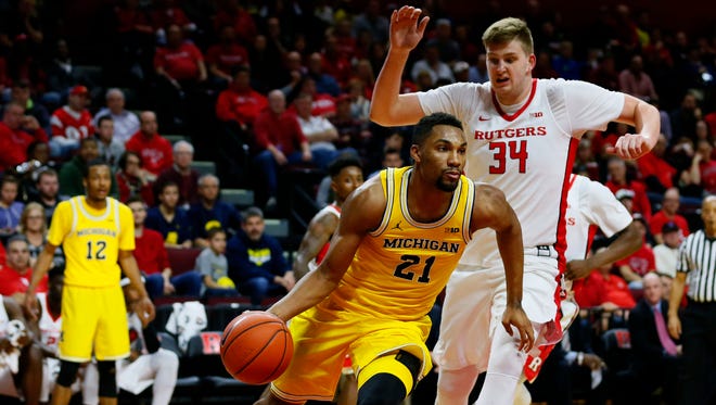 Feb 22, 2017; Piscataway, NJ, USA; Michigan Wolverines guard Zak Irvin drives against Rutgers Scarlet Knights center C.J. Gettys during the first half at Louis Brown Athletic Center.