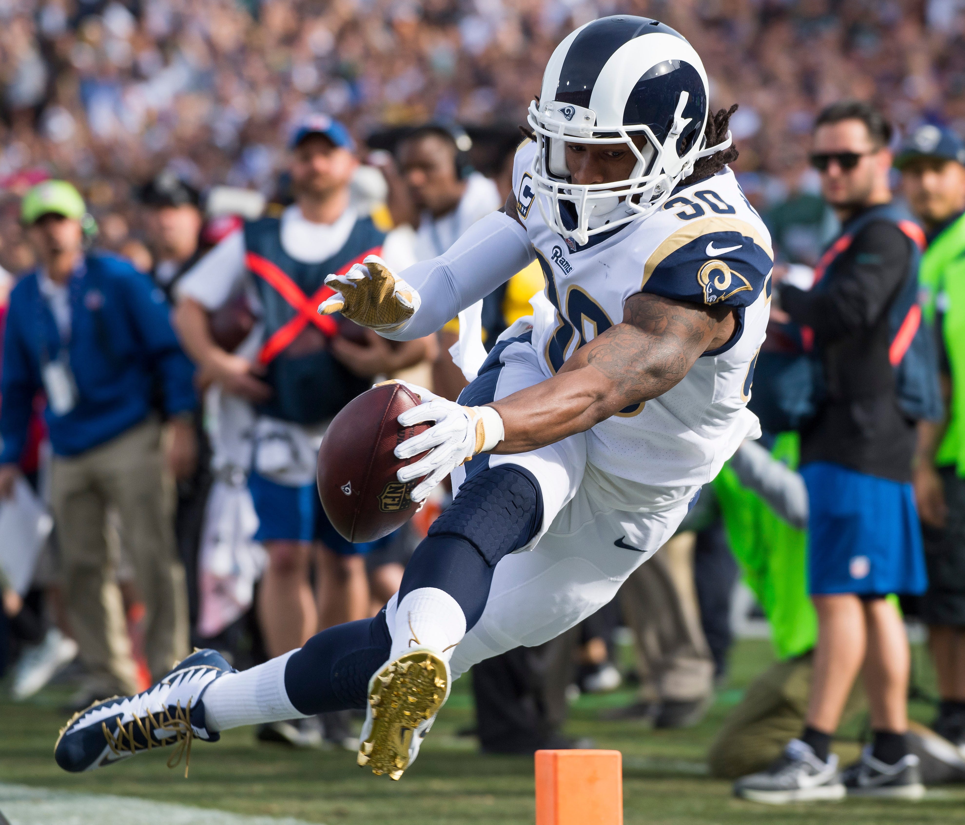 Los Angeles Rams running back Todd Gurley (30) dives toward the end zone during a long first quarter run but is pushed out of bounds two yards short of the end zone against the Philadelphia Eagles at Los Angeles Memorial Coliseum.