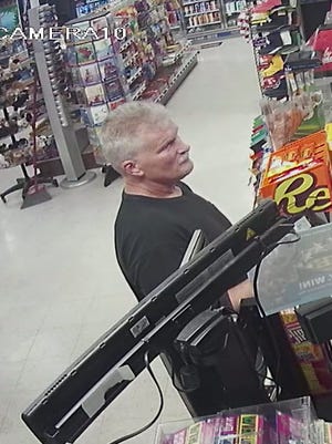 Manitowoc police said the suspect in an armed robbery at the Manitowoc Dollar Tree store Sunday also robbed a Dollar Tree in North Greenbush, New York, last week. Pictured is a still from surveillance video in the North Greenbush incident.