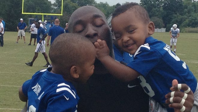 Robert Mathis with his twin sons, Jason and Mason