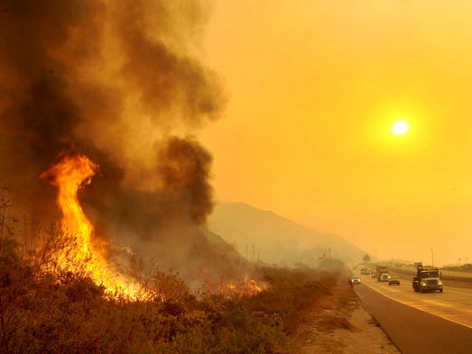 The Thomas Fire burns near Highway 101 in Ventura,