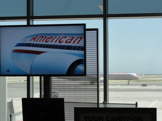 An American Airlines aircraft passes in perspective of an