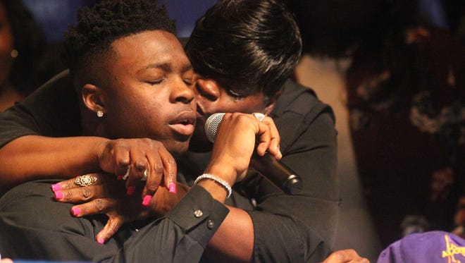 Godby linebacker Treon Patrick gets a kiss from his mom as he breaks down while signing with Alcorn State on national signing day.