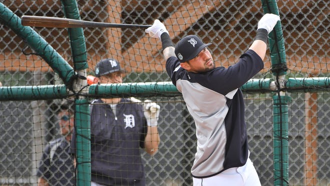 Tigers' Nick Castellanos watches a hit while he takes batting practice.
