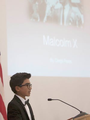 Diego Flores of Juan Lagunas Soria School gives his speech on Malcolm X during the 35th annual African-American Speech Exposition put on by the Xi Kappa Omega Chapter of the Alpha Kappa Alpha Sorority at Thurgood Marshall School in Oxnard. Flores won the competition.