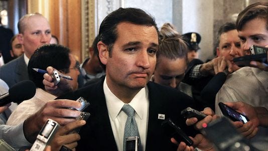 Sen. Ted Cruz, R-Texas, speaks to reporters after controlling the Senate floor for more than 21 hours in effort to defund the Affordable Care Act.