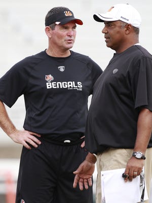 Former Cincinnati Bengals defensive coordinator Mike Zimmer, left, will bring his Minnesota Vikings in for joint training camp practices with Marvin Lewis and the Bengals.