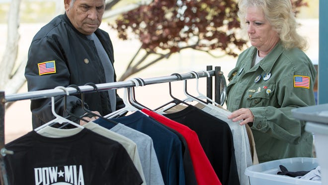 U.S. Army veteran Armando Sanchez looks at military shirts for sale on Saturday, March 31, 2018, during the eighth annual Welcome Home Vietnam Veterans event at Veterans Memorial Park.