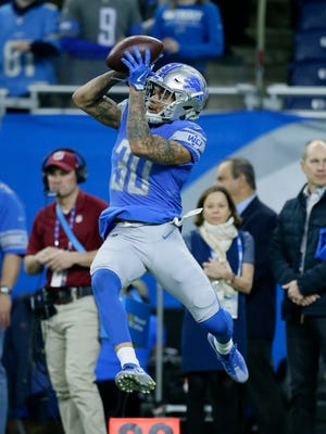 Detroit Lions cornerback Teez Tabor (30) catches during pregame of an NFL football game against the Green Bay Packers, Sunday, Dec. 31, 2017, in Detroit.