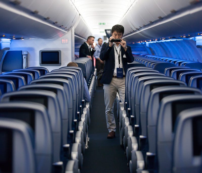A member of the media checks out Delta Air Lines' new Airbus A321 aircraft during a tour at the airlines' Atlanta hub on April 29, 2016.