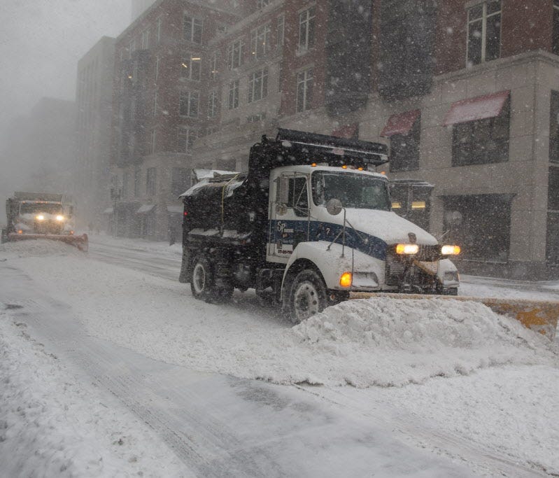 Snowplows clear Berkeley Street in whiteout conditions Feb. 9, 2017, as a winter storm bears down in Boston. Another snowstorm has been forecast with up to a foot of snow in a large swath of the Northeast.