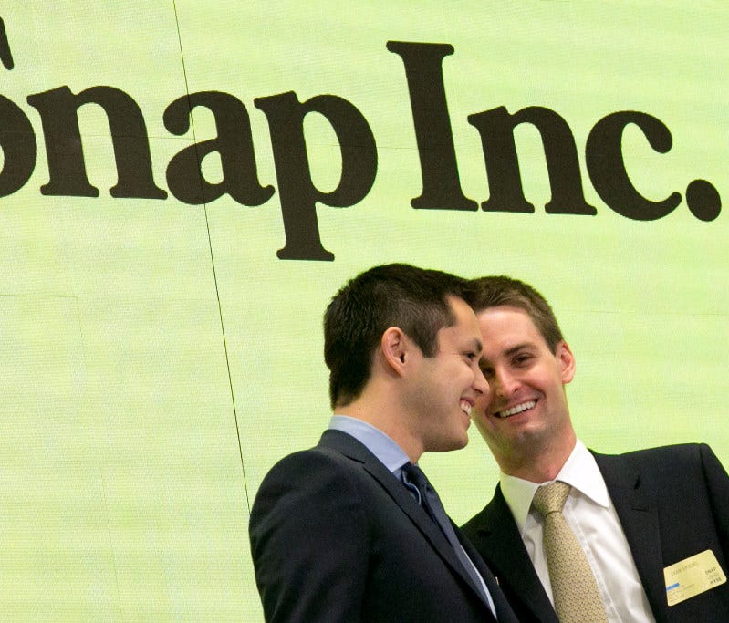 Snapchat co-founders Bobby Murphy, left, and CEO Evan Spiegel ring the opening bell at the New York Stock Exchange as the company celebrates its IPO, Thursday, March 2, 2017
