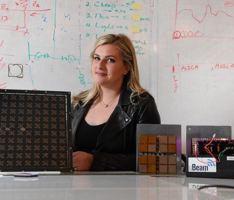 Meredith Perry, 27, is surrounded by various prototypes of her company's ultrasound wireless charging tech. uBeam demonstrated a working model for USA TODAY.