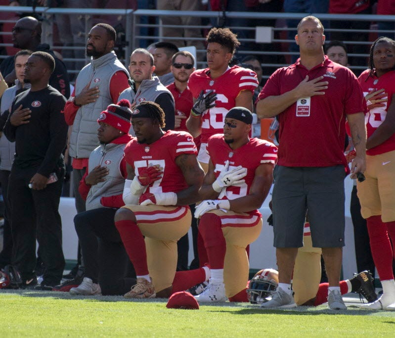 Nov. 5: San Francisco 49ers outside linebacker Eli Harold (57) and strong safety Eric Reid (35) kneel during the national anthem before the game against the Arizona Cardinals at Levi's Stadium.