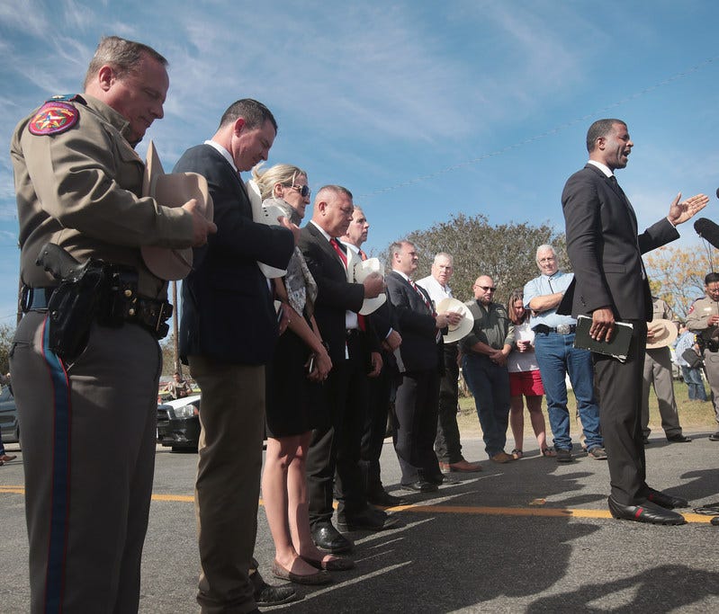 Dimas Salaberrios closes a press briefing with a prayer, Sutherland Springs, Texas, Nov. 6, 2017.