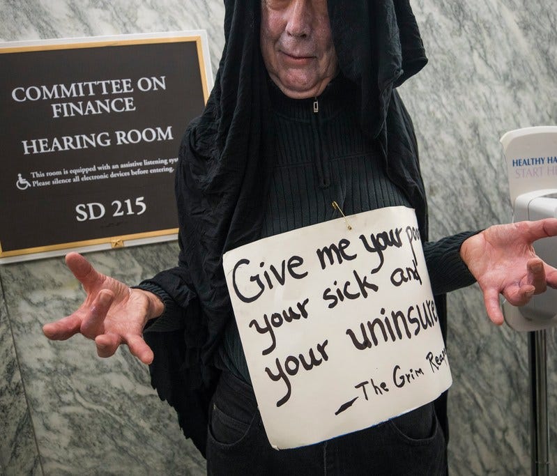 Health bill protester outside a Senate hearing room, Washington, Sept. 25, 2017.