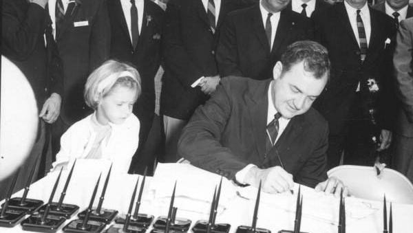 Governor Claude Kirk signing the Disney bill in 1967, granting the Disney Corporation the same rights and responsibilities as a local government through the Reedy Creek Improvement District.