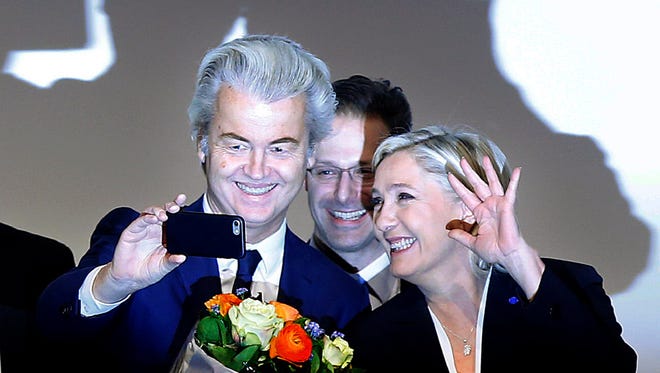 Geert Wilders, left, stands next to Germany's Marcus Pretzell and France's Marine Le Pen during a meeting of European far-right politicians in  in Koblenz, Germany, on Jan. 21.