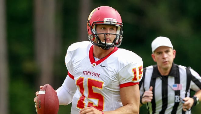 In a Sept. 13, 2014, photo provided by Ferris State University, Ferris State quarterback Jason Vander Laan looks to pass during an NCAA college football game against Northwood in Midland, Mich.