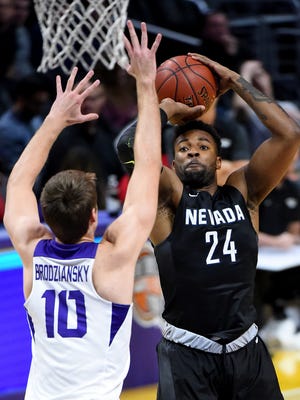 Nevada's Jordan Caroline puts up a shot over TCU's Vladimir Brodziansky  during a Dec. 8 game in Los Angeles. Despite a strong start to the season, Nevada is in the same boat as the rest of the Mountain West when it comes to the NCAA tournament, needing to again win the conference tournament to qualify.