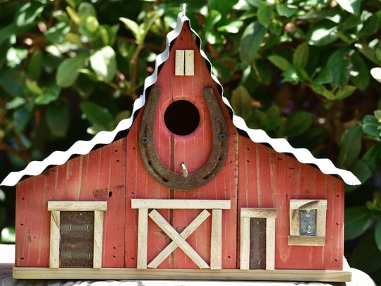 Local Woodworker Creates Unique Birdhouses From Recycled Materials