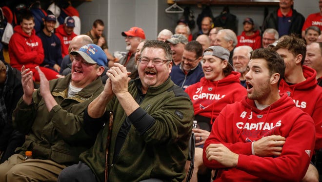 Tim Oshie, father of Washington Capitals right wing T.J. Oshie, laughs at a video clip during a team strategy meeting before playing Chicago on Saturday, Feb. 17, 2018, during the mentors' trip.