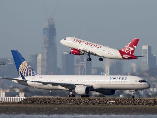 A United Airlines Boeing 757 taxis out for departure