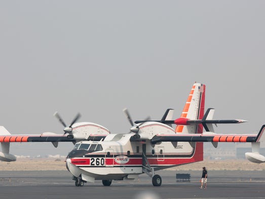 A singular Bombarider water-scooping fire-fightet airplane