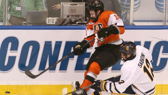 RIT defenseman Brady Norrish moves the puck out of the zone in Friday's semifinal game against Canisius.
