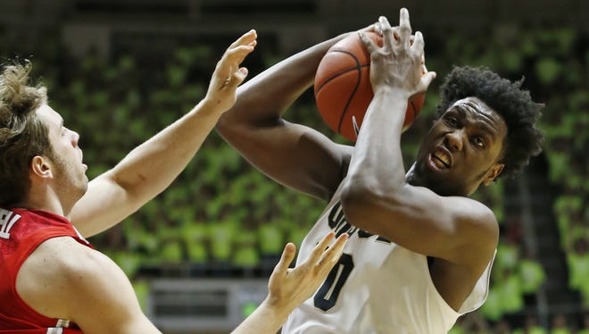 Caleb Swanigan pulls down a rebound in front of Mickey Mitchell of Ohio State Thursday, January 21, 2016, at Mackey Arena. Purdue defeated Ohio State 75-64.