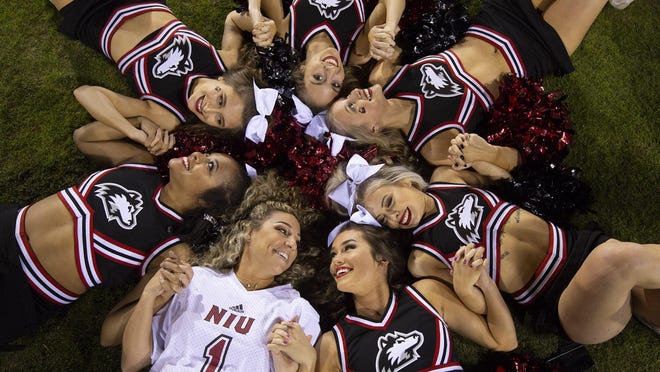 The Northern Illinois Huskies cheerleaders join hands at the Cheribundi Boca Raton Bowl at FAU in Boca Raton, Florida, on Dec. 18, 2018. NIU will not start any of its fall sports until Sept. 3.
