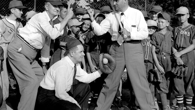 The arguments came quick as the Lions Junior Baseball League opened on 2 Jun 1953 at Treadwell.  The first pitch brought a squawk from batter E.C. Stimbert (Right), Lions Club president, but umpire W.L. Mabry (Left), Treadwell principal, ignored the protest, sticking to his strike call.  The catcher is Dr. W.W. Tribby, head of the Lions' youth activities committee.  The young players in the background were willing enough to go through such official opening ceremonies but they were thinking more about the games which followed.
