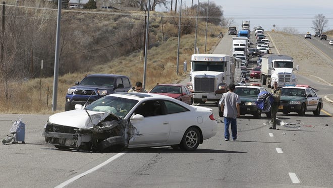 Police on Friday investigate a two-car crash near milemarker 39 on U.S. Highway 64.