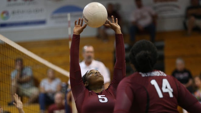 Florida High's Brandi McGee sets the ball during a match against Chiles on Thursday.
