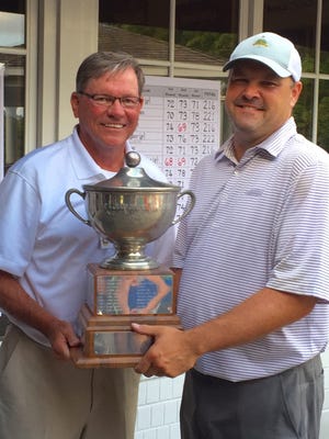 DSGA president Bob Strong (left) presents the Governor's Cup to Delaware Open golf champion Peter Barron on Tuesday at Deerfield Golf Club.