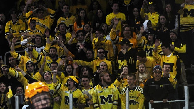 Student section cheers on the Michigan hockey team  at Yost Arena on Jan. 10, 2015.