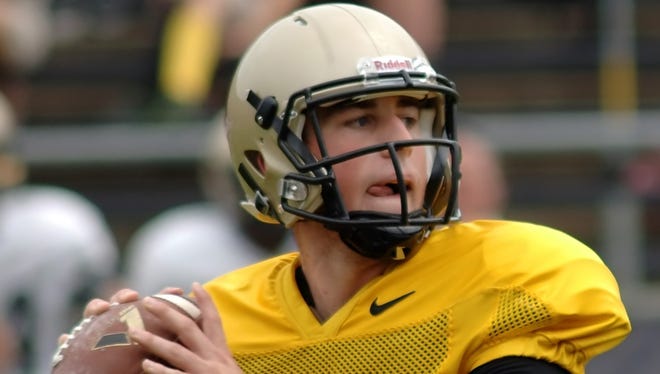 Purdue quarterback Danny Etling watches for an open reciever during scrimmage Saturday at Ross-Ade.