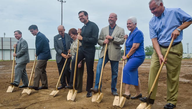 St. Thomas More Catholic High School holds a groundbreaking ceremony for a new 12-classroom addition.