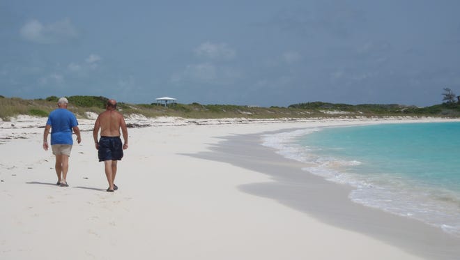 Walking the beach in the Bahamas.