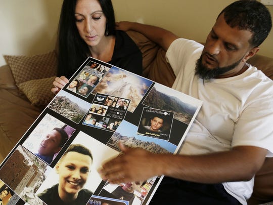 Amanda Mosed, of Dearborn Heights and her ex-husband Fadhl Mosed, of Detroit, look at photos of their 13-year-old son Jayzon who was shot to death during a visit with family to Yemen in October 2014.