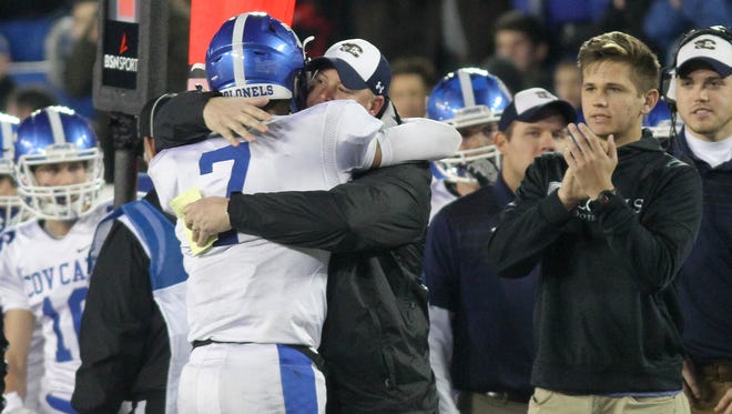 Covington Catholic’s head coach Eddie Eviston and A.J. Mayer  react after the  Colonels win  the state championship  , Saturday, Dec. 2, 2017.