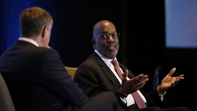 Bernard Tyson, right, explained to Dr. Bill Frist, left, and a Nashville Health Care Council audience why the future of health care is going to be at home, and not in a hospital.
