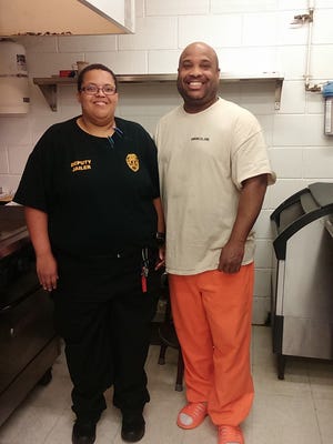 Class D Coordinator Tiretta Huntspon poses with student Terrance.  Huntspon has been an employee of the jail for over 10 years, and Terrance just earned his Gold NCRC in September.  The story and more photos can be found on A7.