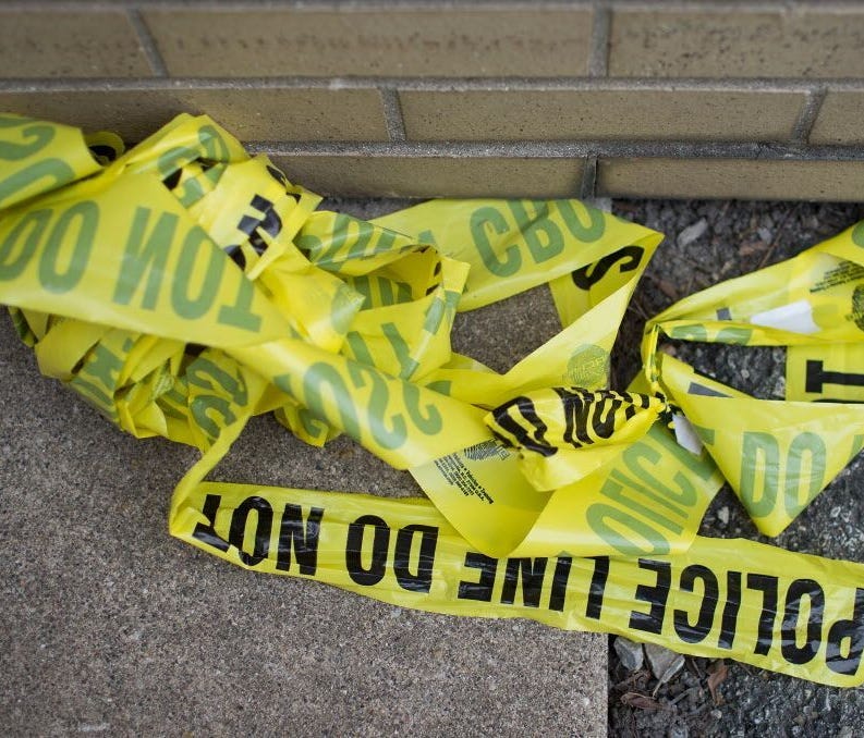 Remnants of crime scene tape remain on the ground in Foster Park following a shooting on April 19, 2016 in Chicago, Illinois. Ten people were wounded, including two fatally, in a gang-related ambush in Chicago's Brighton Park neighborhood on Sunday, 